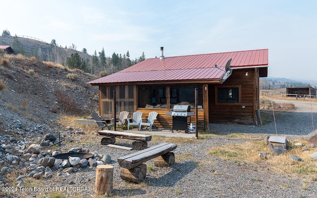 back of property featuring a sunroom