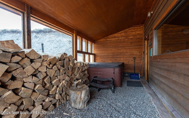 interior space featuring wood walls and wooden ceiling