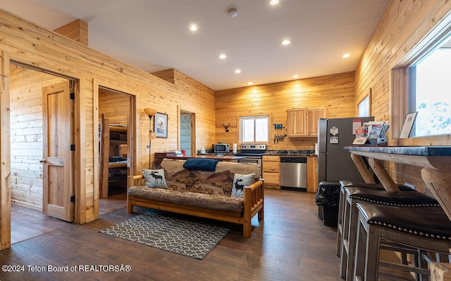 living room with wood walls and dark wood-type flooring