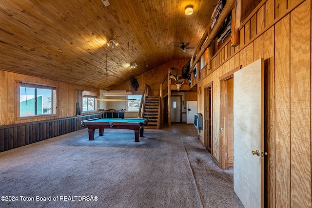 rec room featuring wood walls, lofted ceiling, wood ceiling, carpet floors, and ceiling fan