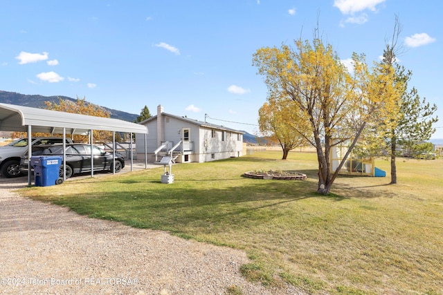 view of yard featuring a carport