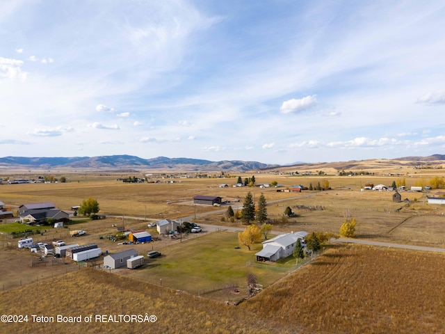 bird's eye view with a mountain view and a rural view