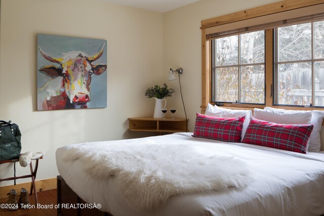 bedroom featuring hardwood / wood-style flooring