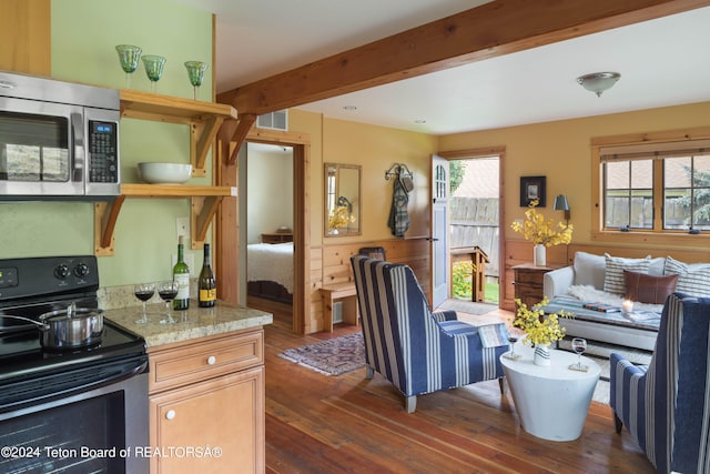 kitchen featuring beamed ceiling, light stone countertops, black / electric stove, and dark hardwood / wood-style flooring