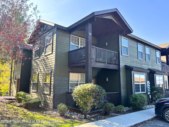 view of home's exterior featuring a balcony