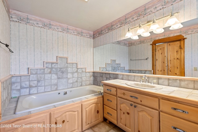 bathroom with vanity and a tub to relax in