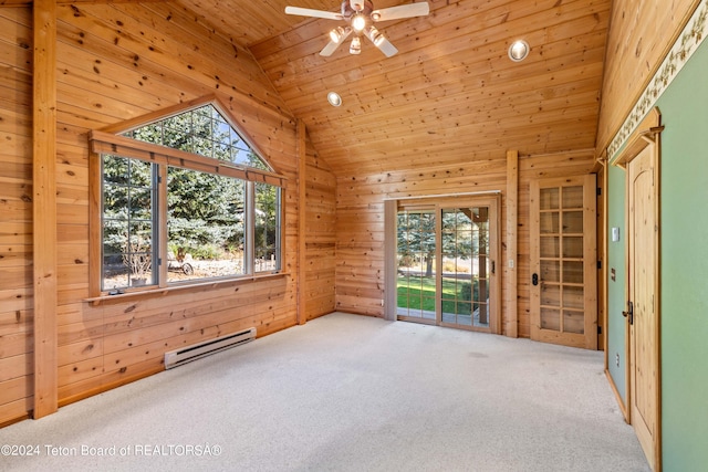 spare room featuring wood ceiling, a baseboard radiator, and plenty of natural light