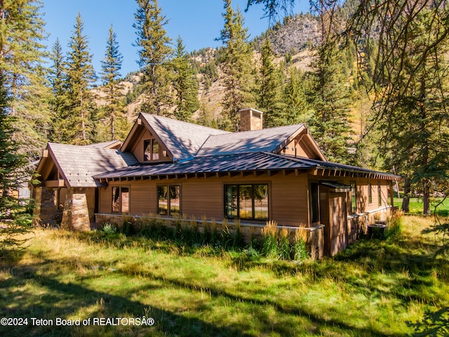 view of home's exterior with a mountain view