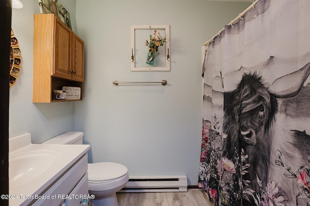 bathroom featuring toilet, a baseboard heating unit, wood-type flooring, a shower with shower curtain, and vanity