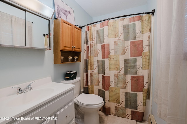 bathroom with vanity, toilet, and a baseboard radiator