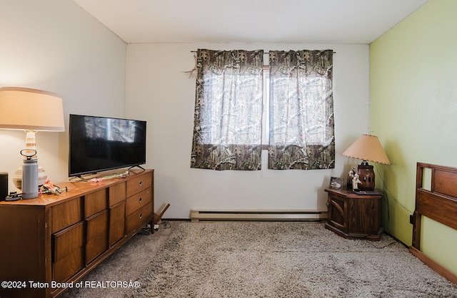 carpeted bedroom with a baseboard heating unit