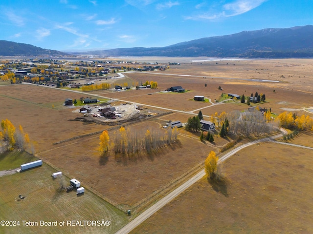 aerial view featuring a mountain view and a rural view