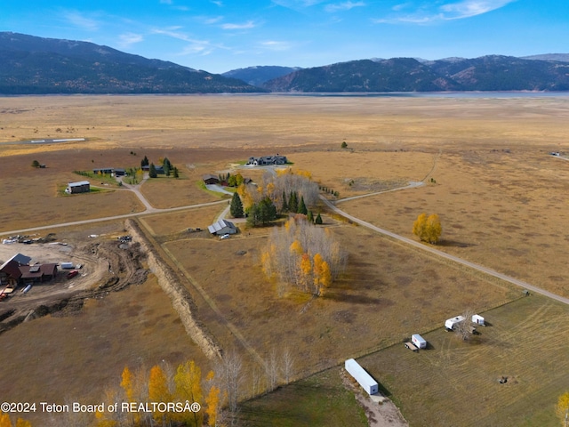 drone / aerial view with a mountain view and a rural view