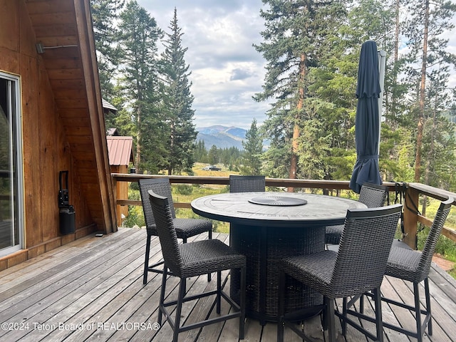 wooden terrace with a mountain view