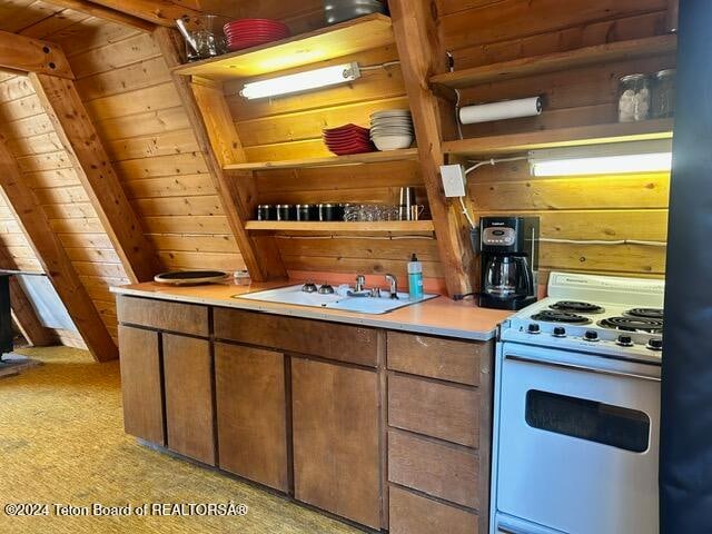 kitchen featuring wood walls, light carpet, white stove, and wooden ceiling