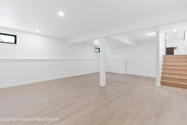 basement featuring light wood-type flooring