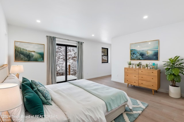 bedroom featuring access to outside and light hardwood / wood-style flooring