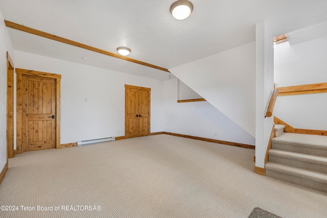 bonus room featuring a baseboard radiator and carpet floors