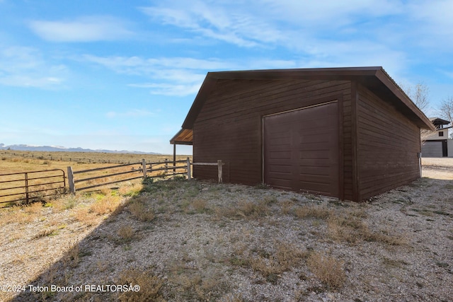 view of outbuilding with a rural view