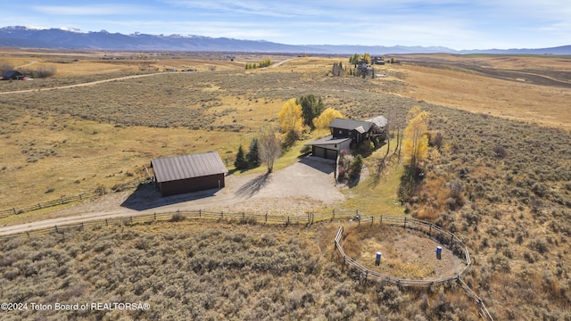 aerial view with a mountain view and a rural view