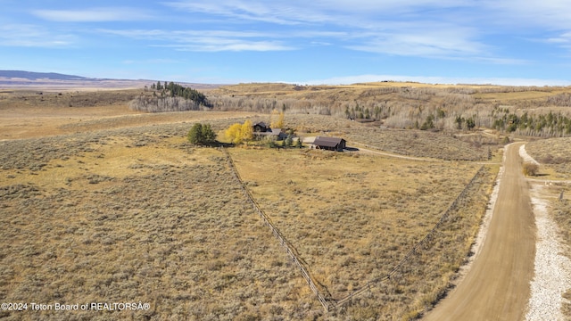 aerial view featuring a mountain view and a rural view