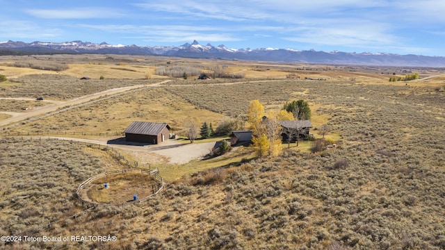 aerial view with a mountain view and a rural view