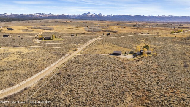 drone / aerial view featuring a mountain view and a rural view