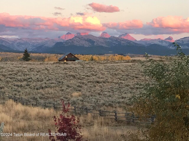 mountain view featuring a rural view