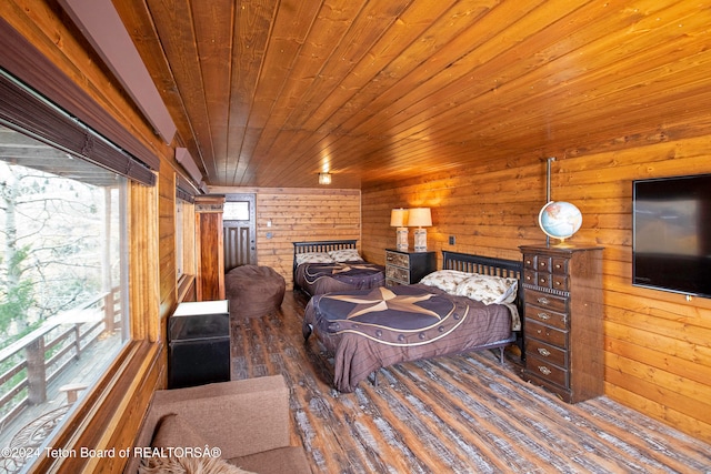 bedroom with dark wood-type flooring, wooden ceiling, and wooden walls