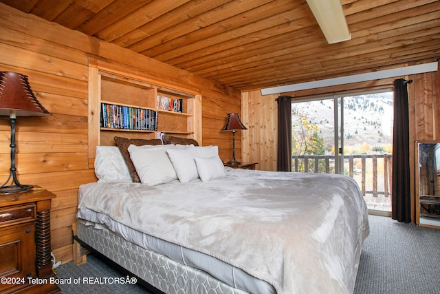 bedroom with wooden ceiling, access to exterior, wooden walls, and carpet flooring