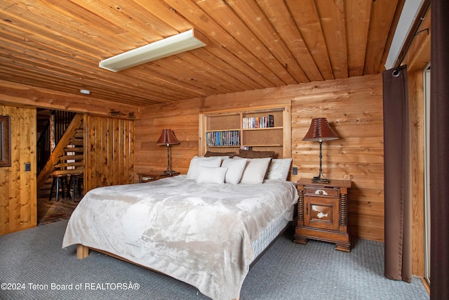 carpeted bedroom featuring wood ceiling and wooden walls