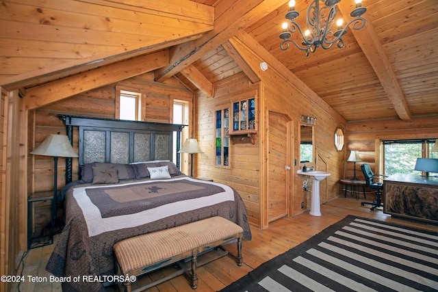 bedroom with wooden walls, wood ceiling, vaulted ceiling with beams, and light hardwood / wood-style floors