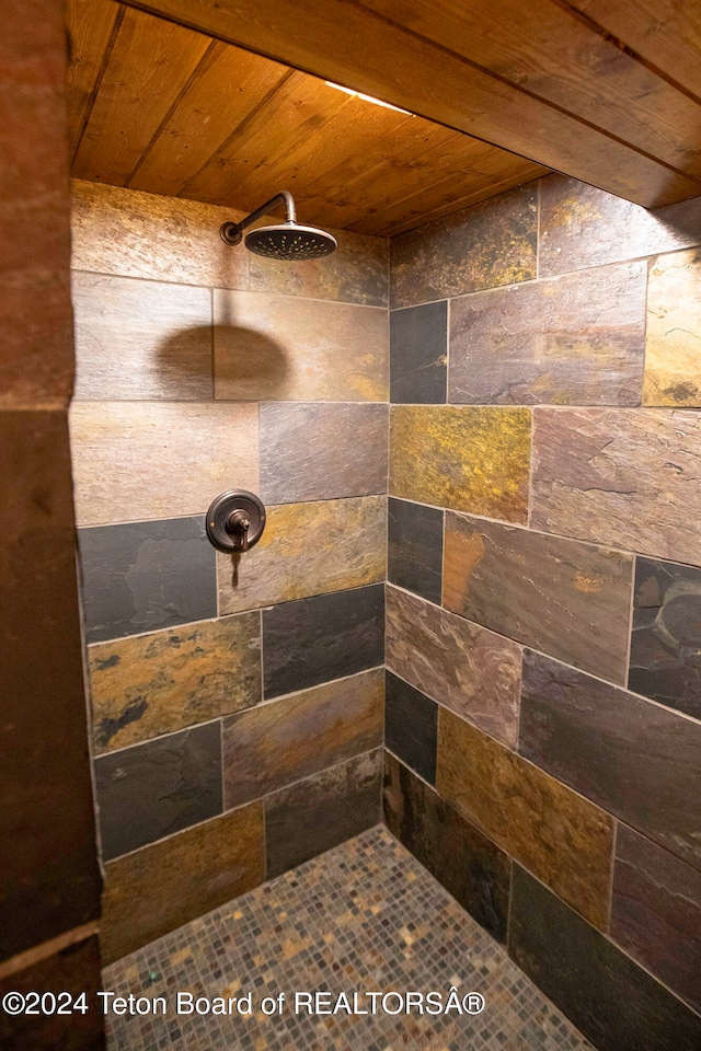 bathroom featuring walk in shower and wooden ceiling