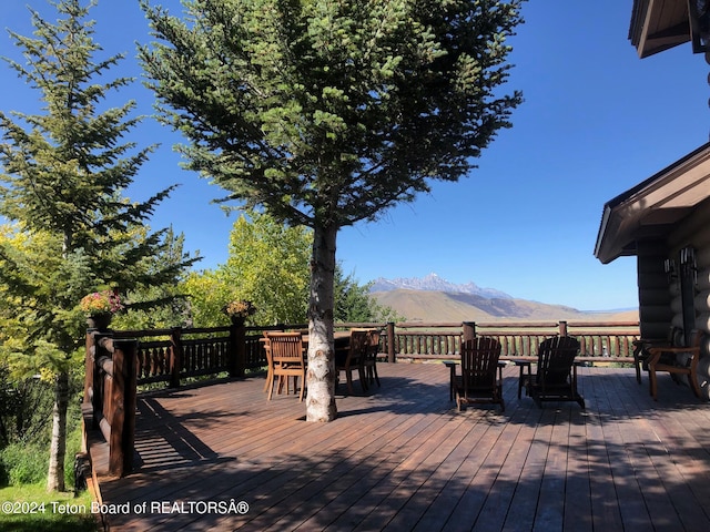 wooden deck featuring a mountain view