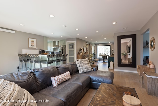 living room with light hardwood / wood-style flooring