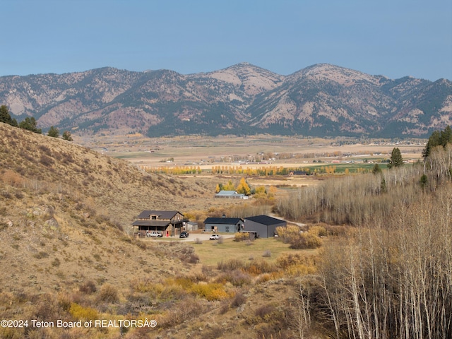 view of mountain feature with a rural view