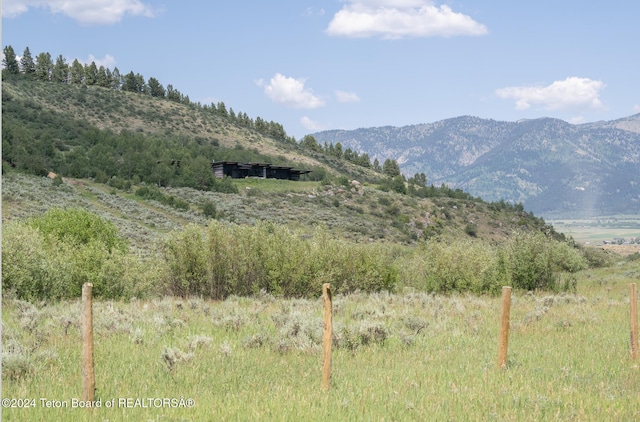 view of mountain feature featuring a rural view