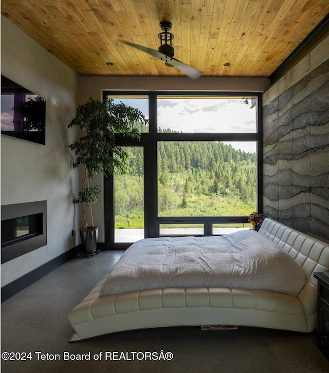 unfurnished bedroom with carpet and wooden ceiling