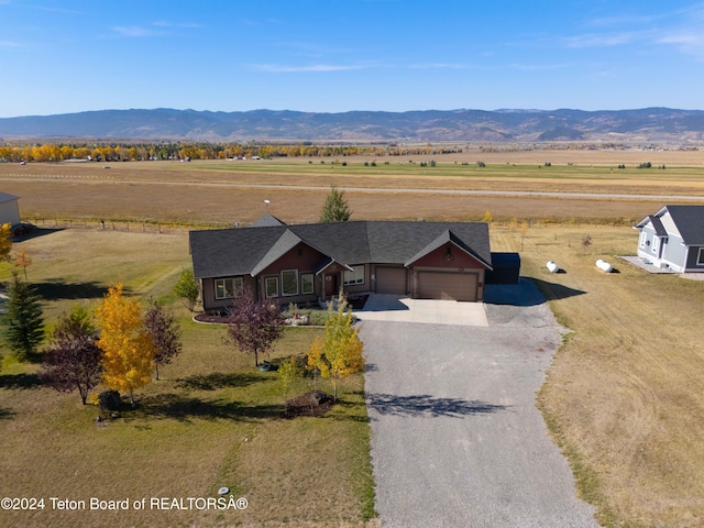 drone / aerial view with a rural view and a mountain view