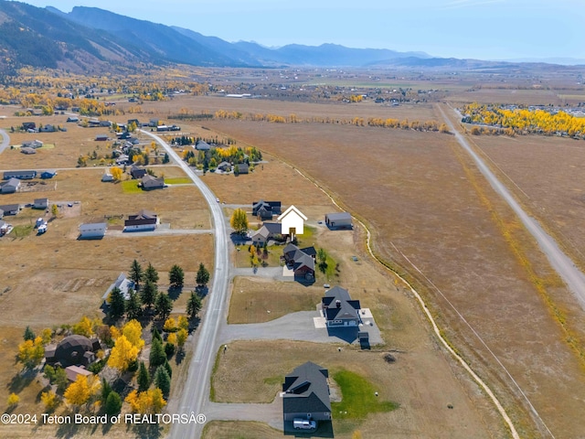 bird's eye view with a rural view and a mountain view