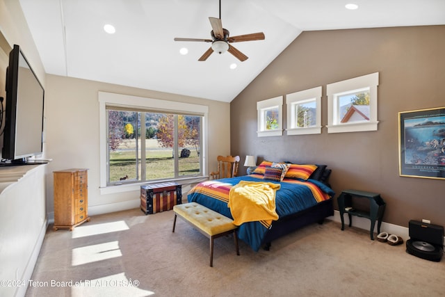 carpeted bedroom with ceiling fan and lofted ceiling