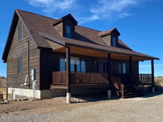 8 S Kicking Bird Rd, Pinedale, WY 82941 - view of front of property with covered porch and a shingled roof