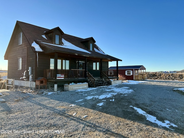 8 S Kicking Bird Rd, Pinedale, WY 82941 - view of front of property featuring a porch and an outdoor structure