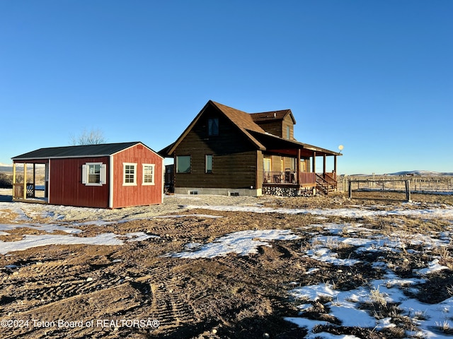 8 S Kicking Bird Rd, Pinedale, WY 82941 - snow covered property featuring a shed