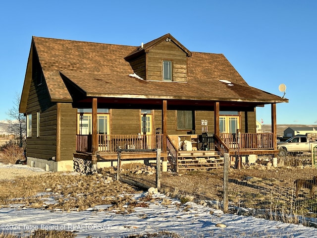 8 S Kicking Bird Rd, Pinedale, WY 82941 - view of front of home with a porch and roof with shingles