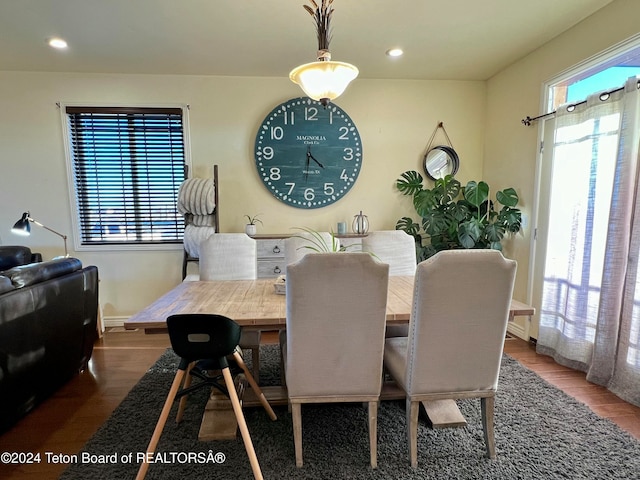 dining space with wood-type flooring