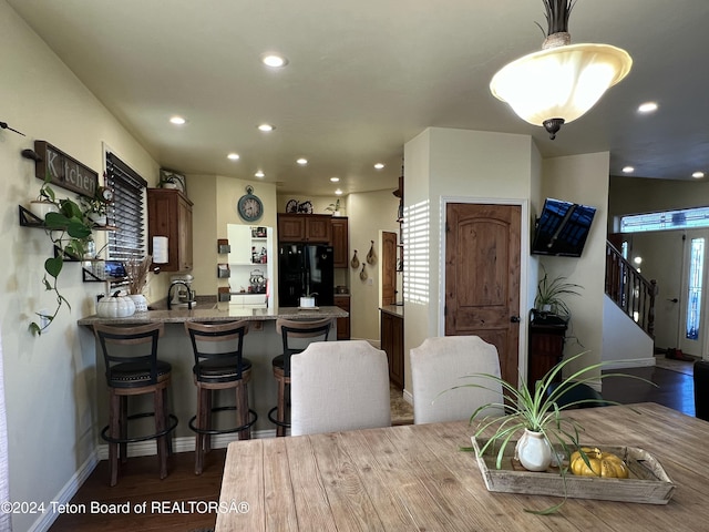 8 S Kicking Bird Rd, Pinedale, WY 82941 - dining area featuring recessed lighting, dark wood-style flooring, and stairway