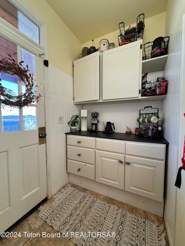 kitchen featuring white cabinets