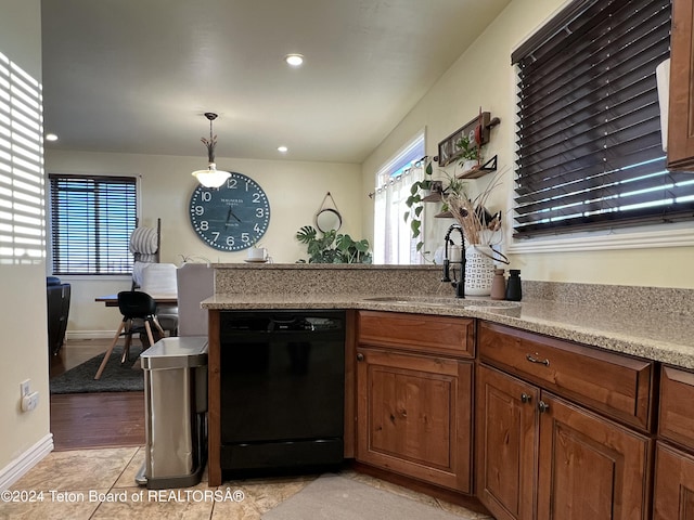 8 S Kicking Bird Rd, Pinedale, WY 82941 - kitchen featuring black dishwasher, brown cabinets, light countertops, pendant lighting, and recessed lighting