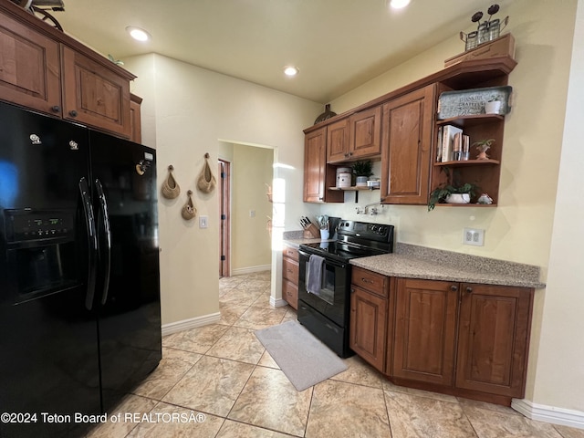 8 S Kicking Bird Rd, Pinedale, WY 82941 - kitchen with black appliances, open shelves, recessed lighting, light stone counters, and light tile patterned floors